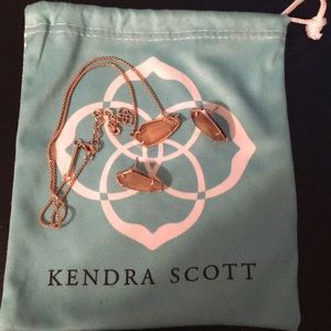 Rose gold Kendra Scott earrings and necklace